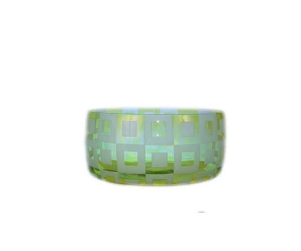 A green bowl with squares on it