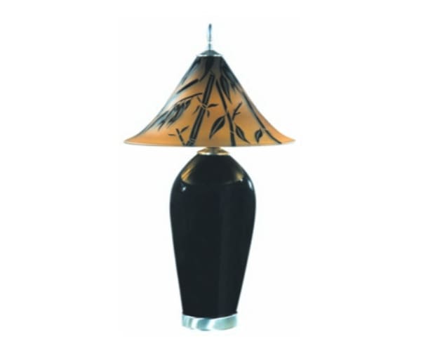 A black lamp with a brown shade on top of it.