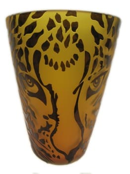 A yellow vase with a leopard print design.