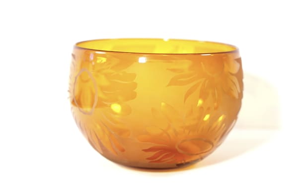 A bowl with leaves on it is shown.