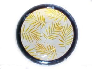 A round plate with yellow leaves on it.