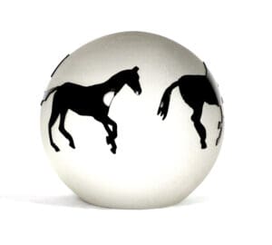 A white ball with two black horses on it.