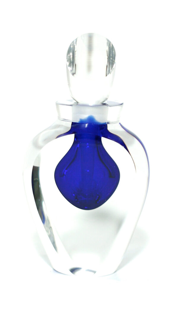 A blue glass bottle with a clear base.