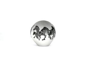 A white ball with black zebras on it