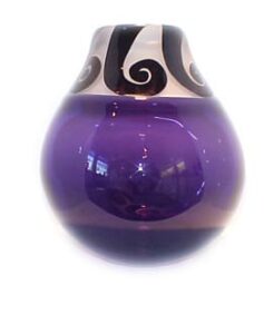 A purple glass vase with black swirls on it.