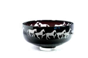 A bowl with horses on it