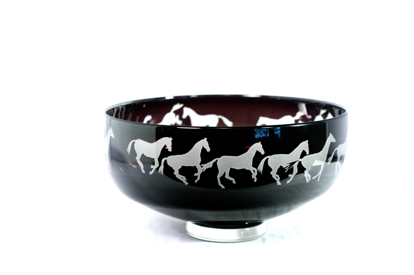 A bowl with horses on it