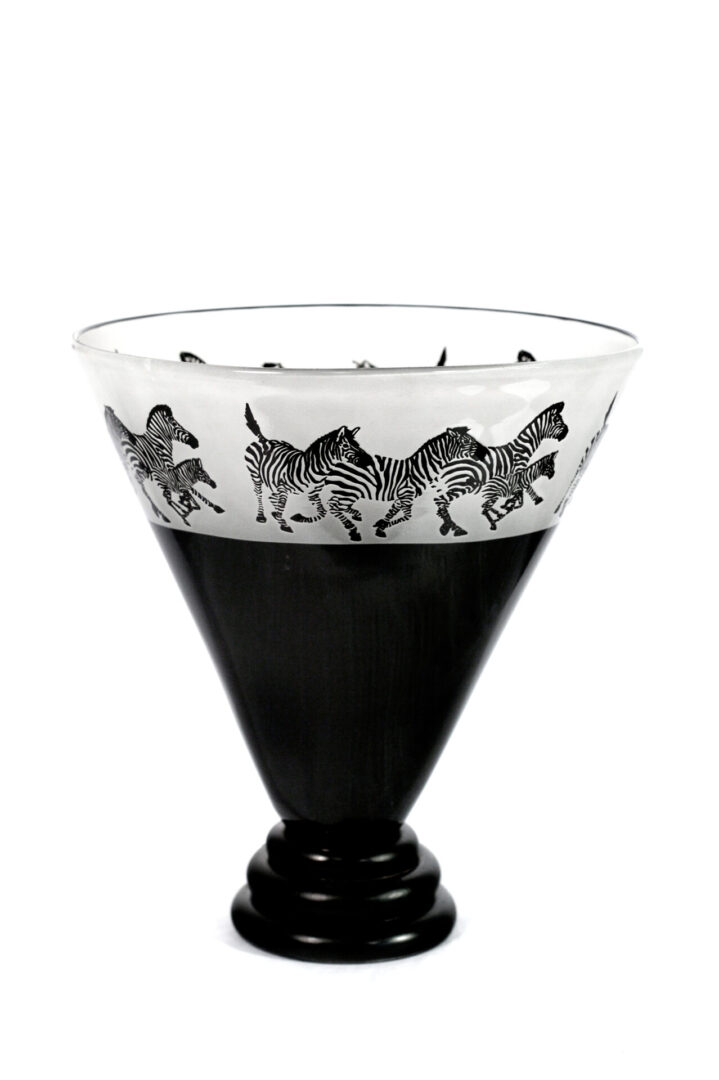 A black and white glass with zebra design