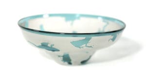 A bowl with a blue and white design on it.