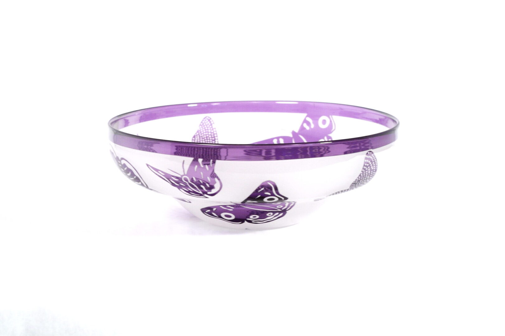 A bowl with purple butterflies on it.