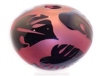 A pink and black ball with hands on it