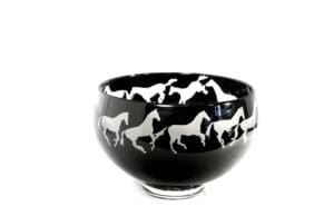 A bowl with horses on it