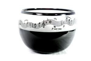 A bowl with musical notes on it.