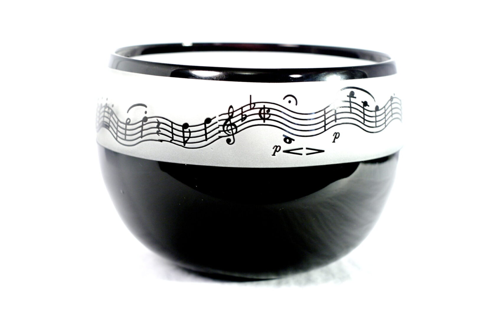 A bowl with musical notes on it.