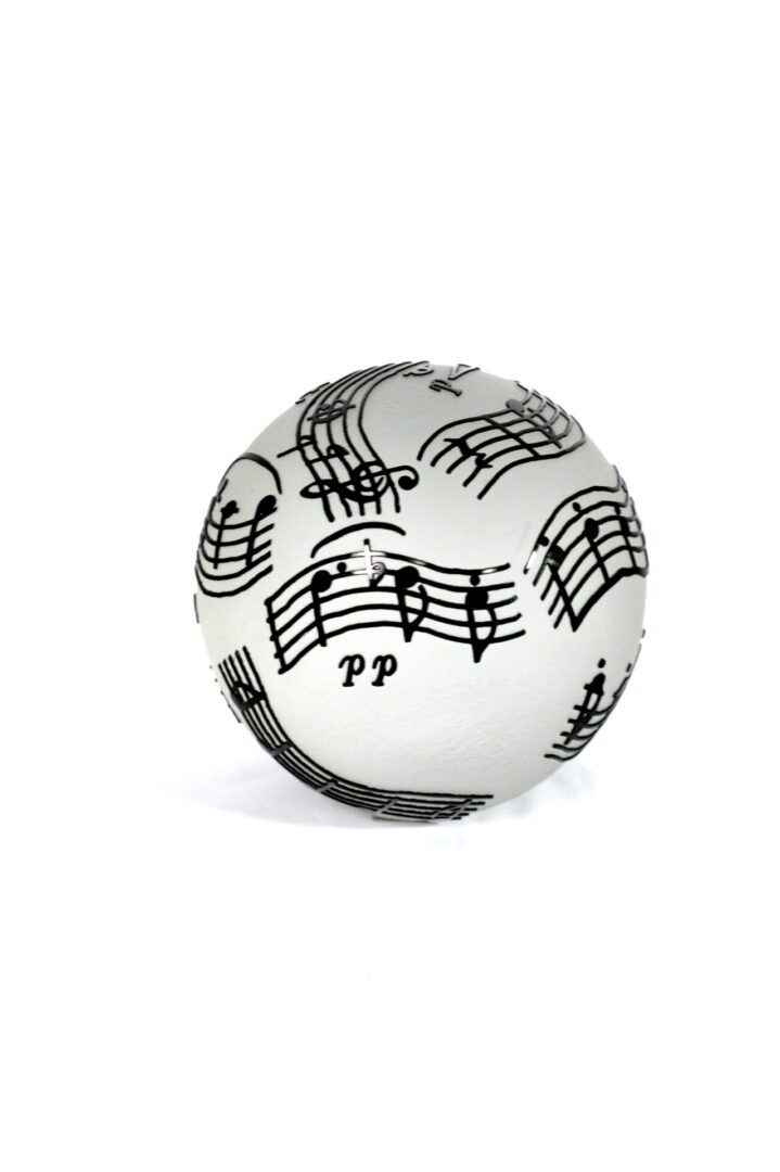 A white ball with musical notes on it.