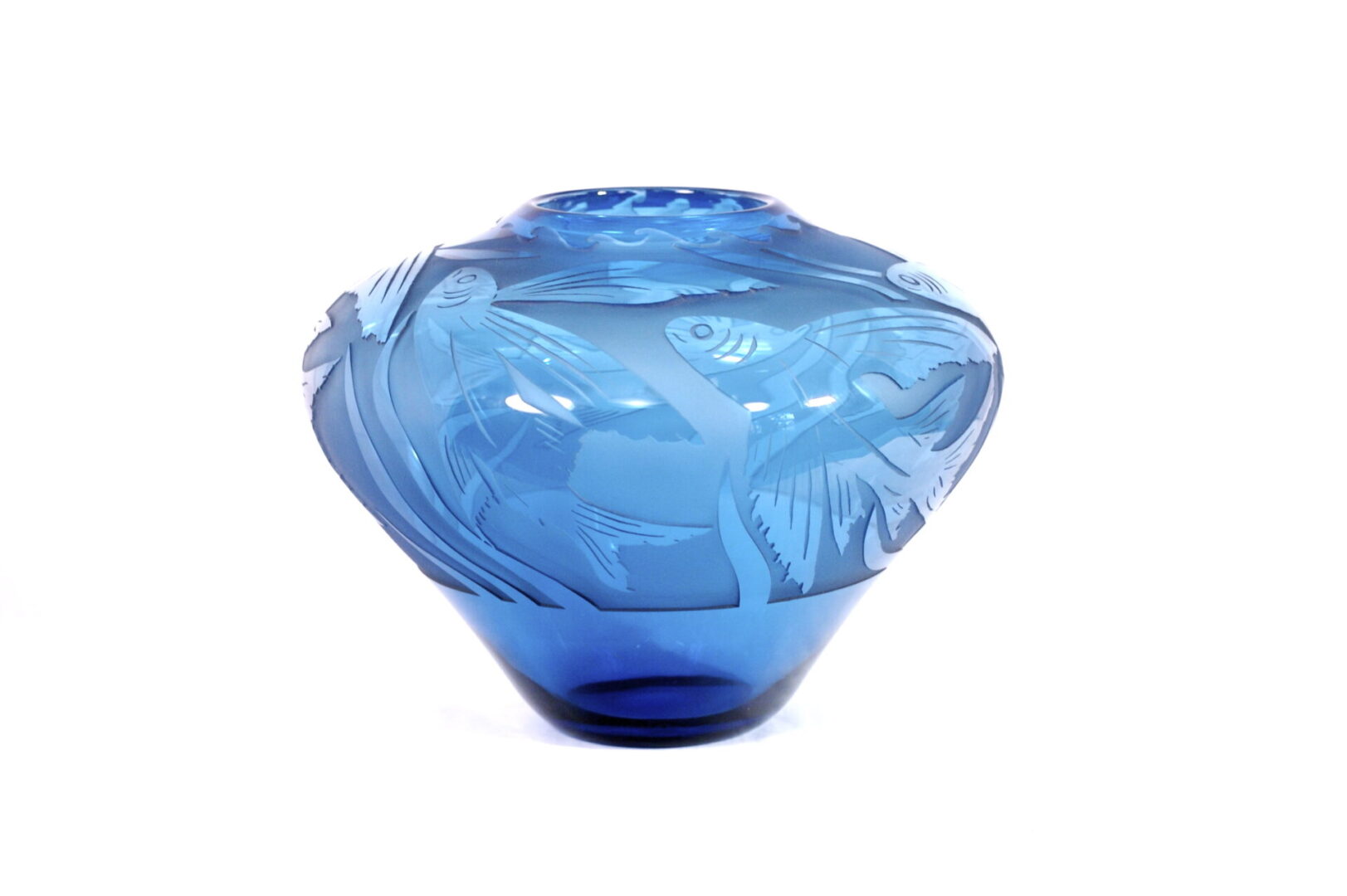 A blue glass bowl with a plastic cover on top.