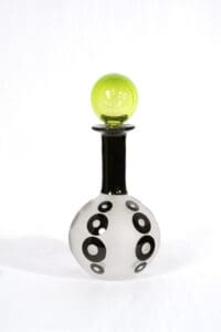 A black and white bottle with a yellow top