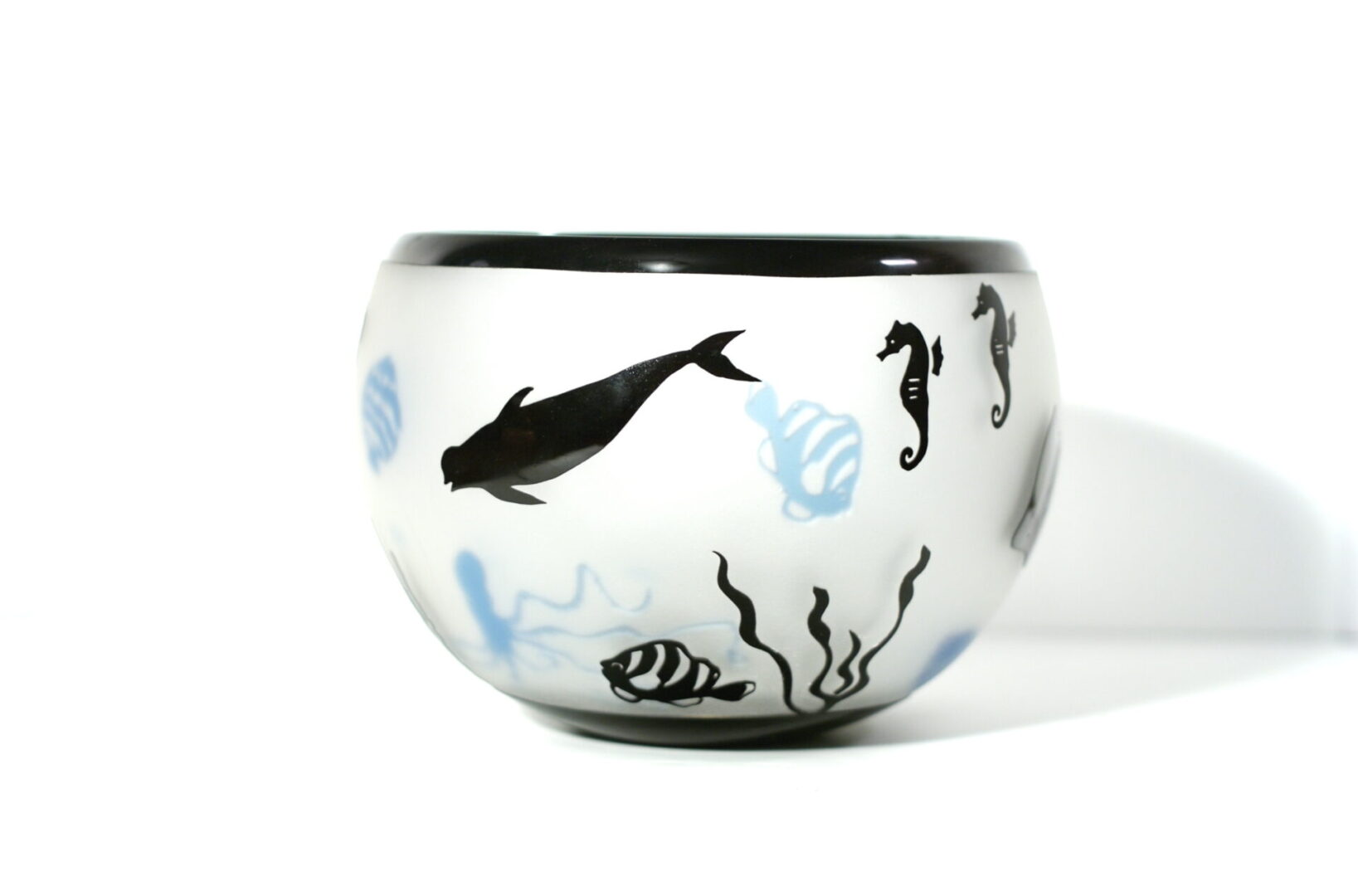 A bowl with sea animals painted on it