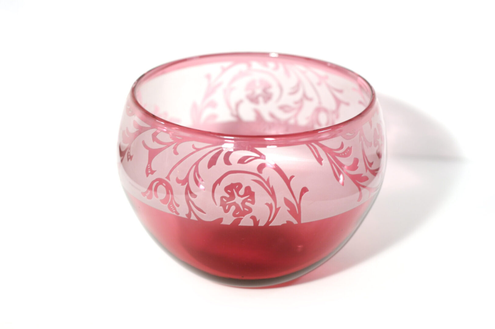 A bowl with a red and white design on it.