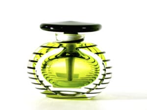 A green glass bottle with a black lid.